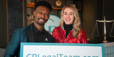 Team members holding CRLegalTeam.com sign.