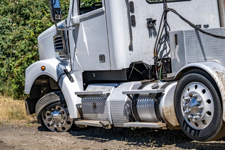 A damaged white FedEx truck after an accident. Learn what to do after an accident with a FedEx Truck.