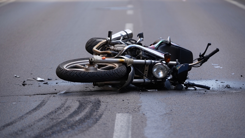 A damaged motorcycle lying on the ground. Learn about what to do if you’re injured at a motorcycle rally in North Carolina.