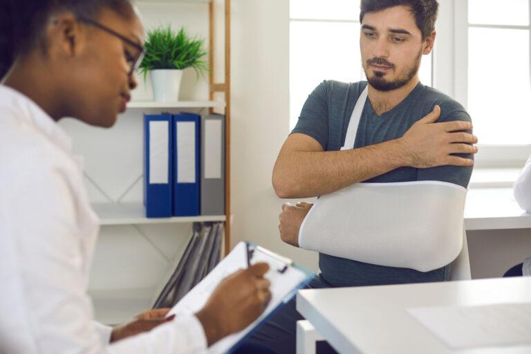 A car accident victim consults with a doctor after a collision and asks what common injuries are after a car accident.