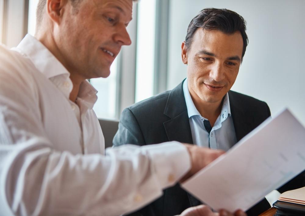 A lawyer helps his client after he asks, “How do I get a crash report in Concord, NC?”