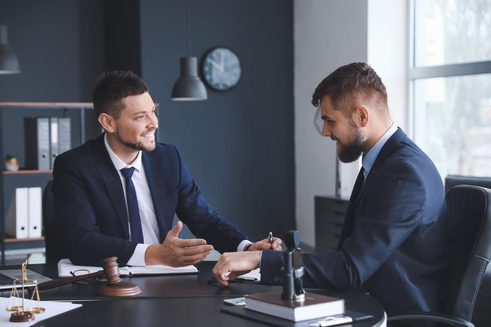 An attorney helps his client understand how to get a crash report in Gastonia, NC.