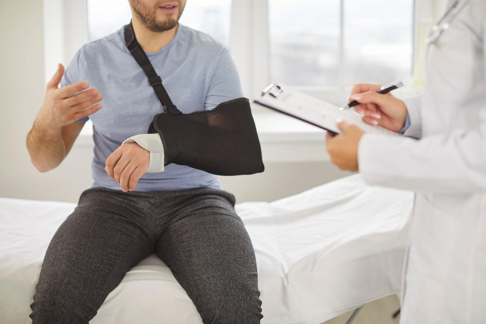 An injured man talking to a doctor and wondering what to do if you’re injured at the Lenovo Center.