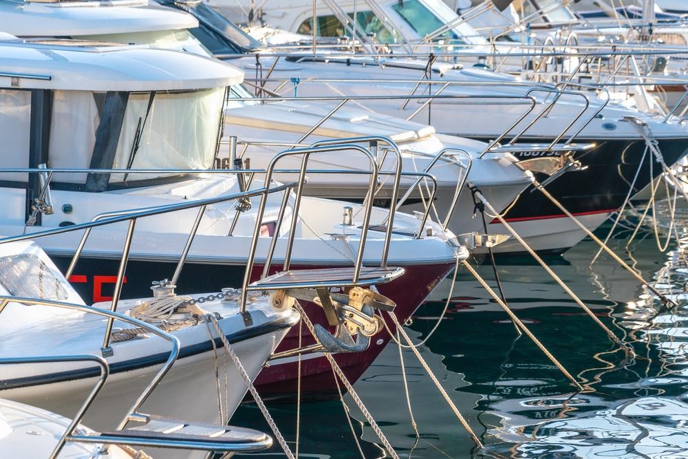 photo of boats docked in a marina for an article that explains how liability is determined after a boat accident.