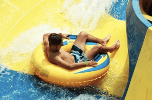 A person rides an inflatable tube through moving water during a recreational tubing outing. After a tubing accident, documenting the scene, seeking medical care, and understanding your legal rights can all be important steps.