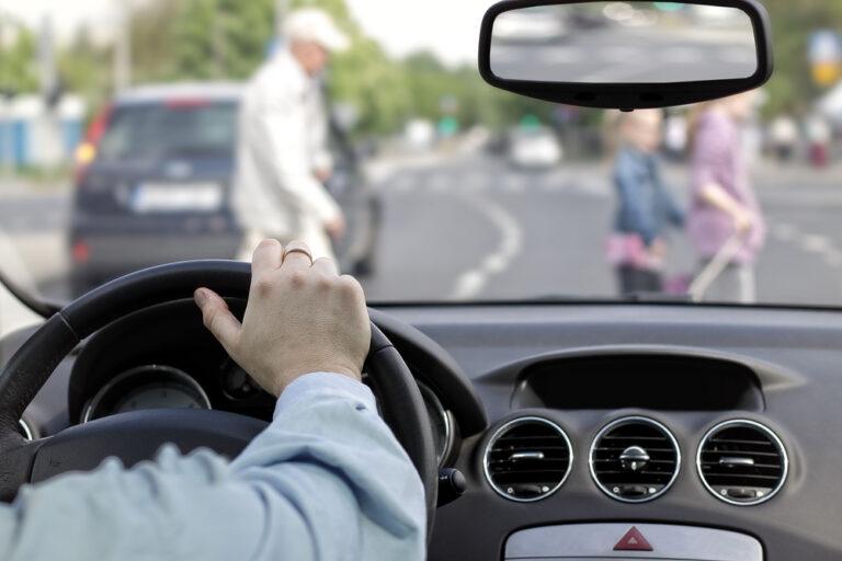 A distracted driver nearly hits a frightened man in a crosswalk. Who’s responsible for a pedestrian accident near UNC-Greensboro?